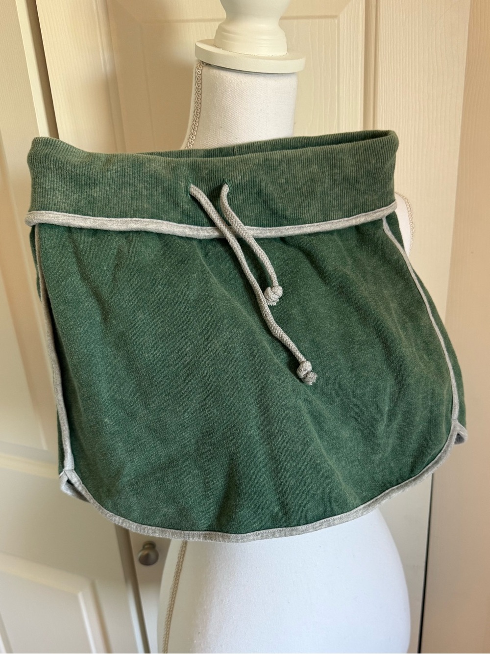 Green Drawstring Mini Skirt with Contrast Trim and attached shorts